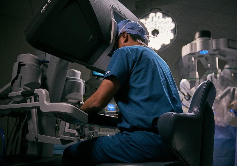 surgeon using a robot